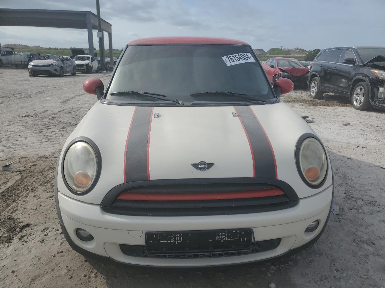 2009 Mini Cooper VIN: WMWMF335X9TW74447 Lot: 76154004