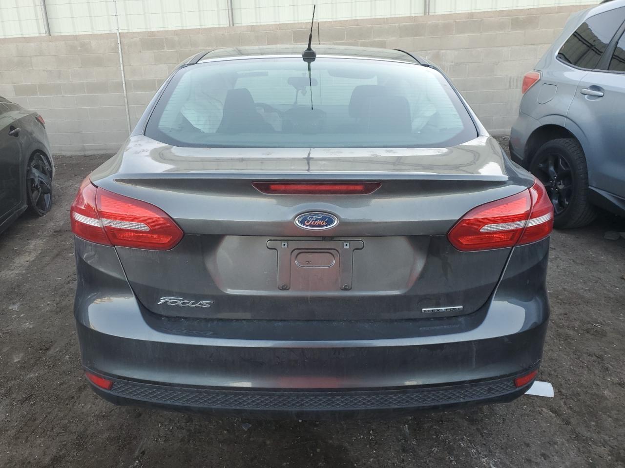 2016 Ford Focus S VIN: 1FADP3E26GL207323 Lot: 80983704