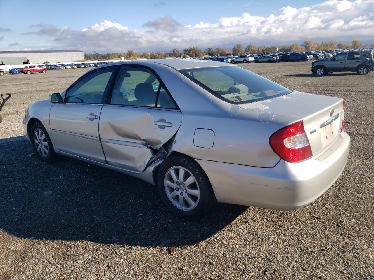 2003 Toyota Camry Le VIN: 4T1BF30K93U557105 Lot: 82450474