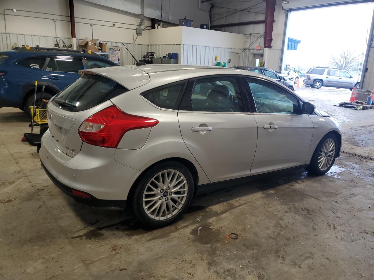 2014 Ford Focus Titanium VIN: 1FADP3N29EL340249 Lot: 86011464