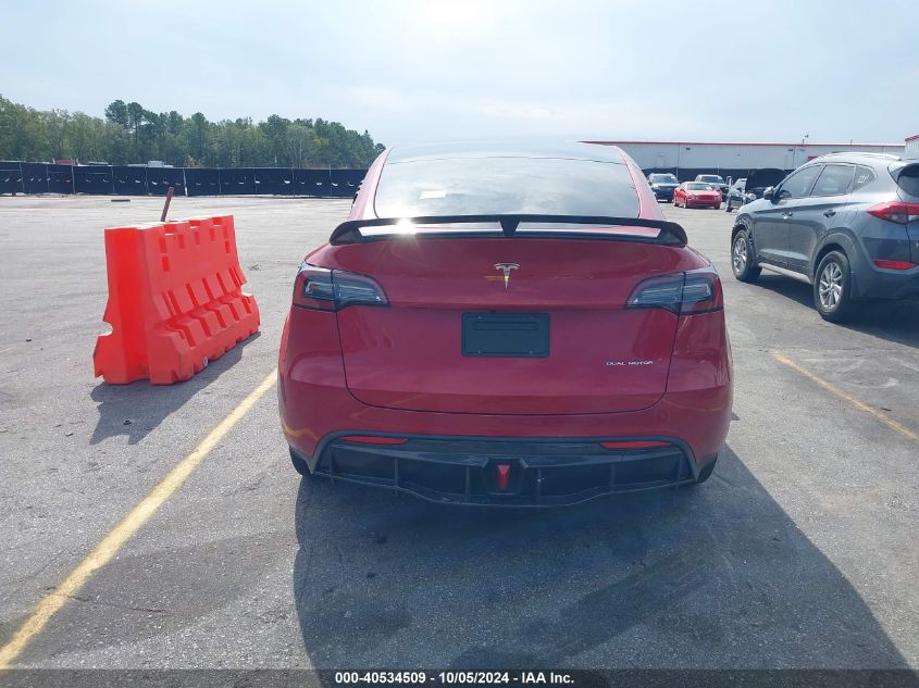 2023 Tesla Model Y Awd/Long Range Dual Motor All-Wheel Drive VIN: 7SAYGDEE4PF707613 Lot: 40534509