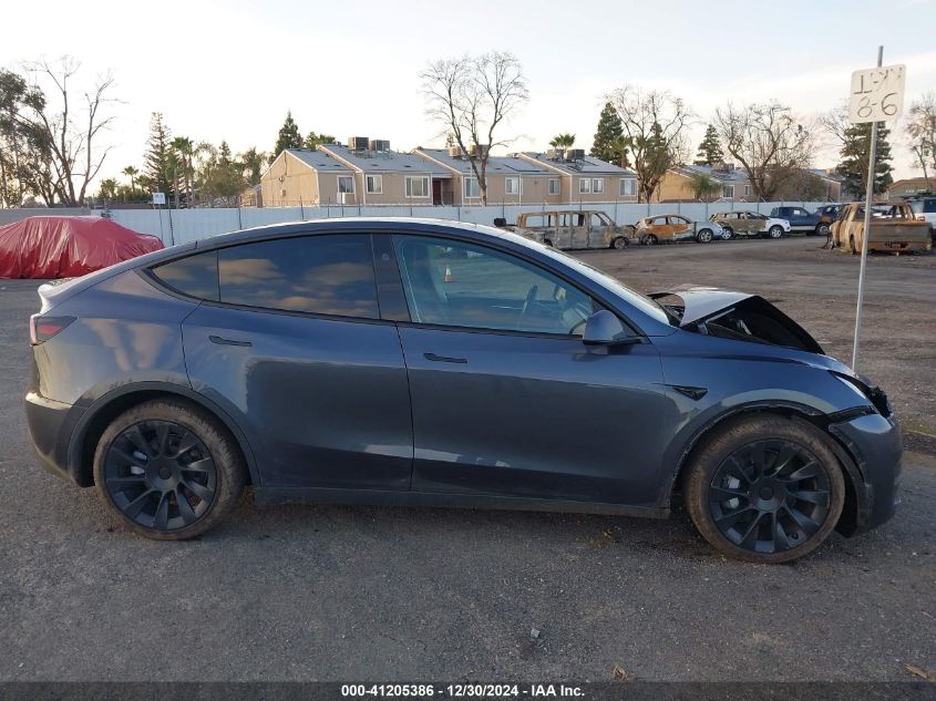 2023 Tesla Model Y Awd/Long Range Dual Motor All-Wheel Drive VIN: 7SAYGDEE9PF858527 Lot: 41205386