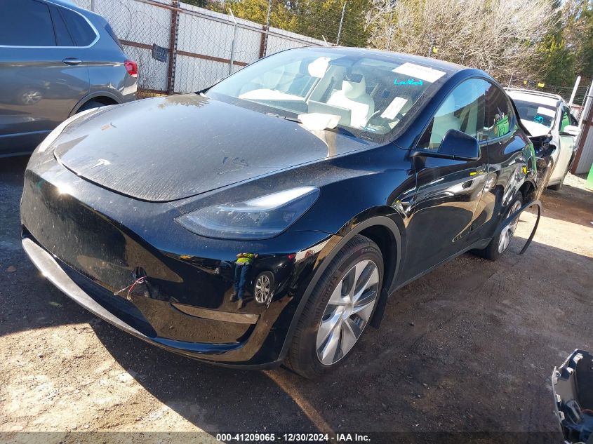 2023 Tesla Model Y Awd/Long Range Dual Motor All-Wheel Drive VIN: 7SAYGDEE3PF773151 Lot: 41209065