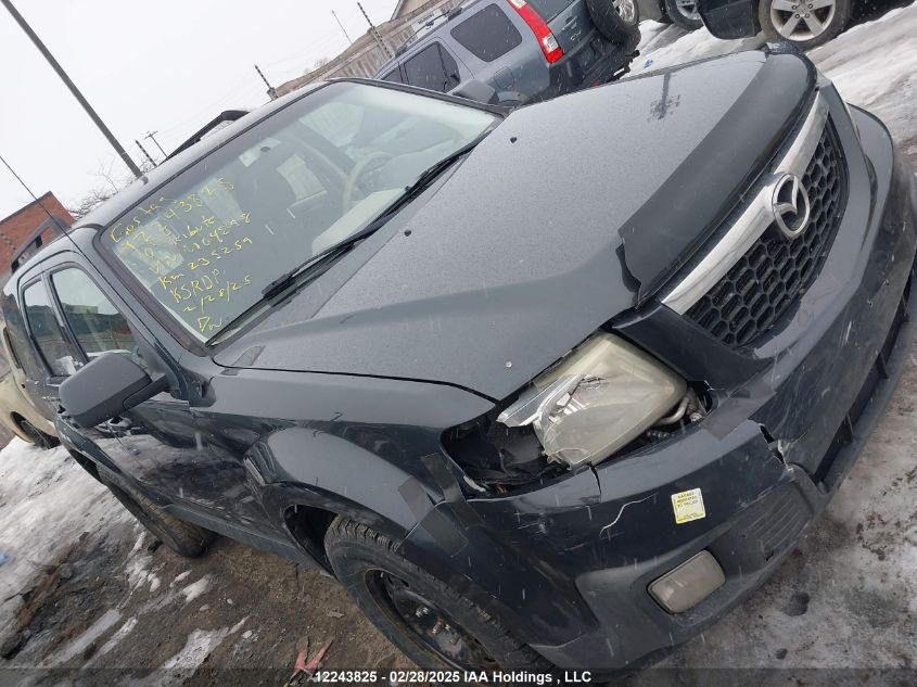 2010 Mazda Tribute Gx I4 VIN: 4F2CY9C7XAKM04898 Lot: 12243825